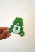 Sticker Bisounours vert au trèfle à quatre feuilles